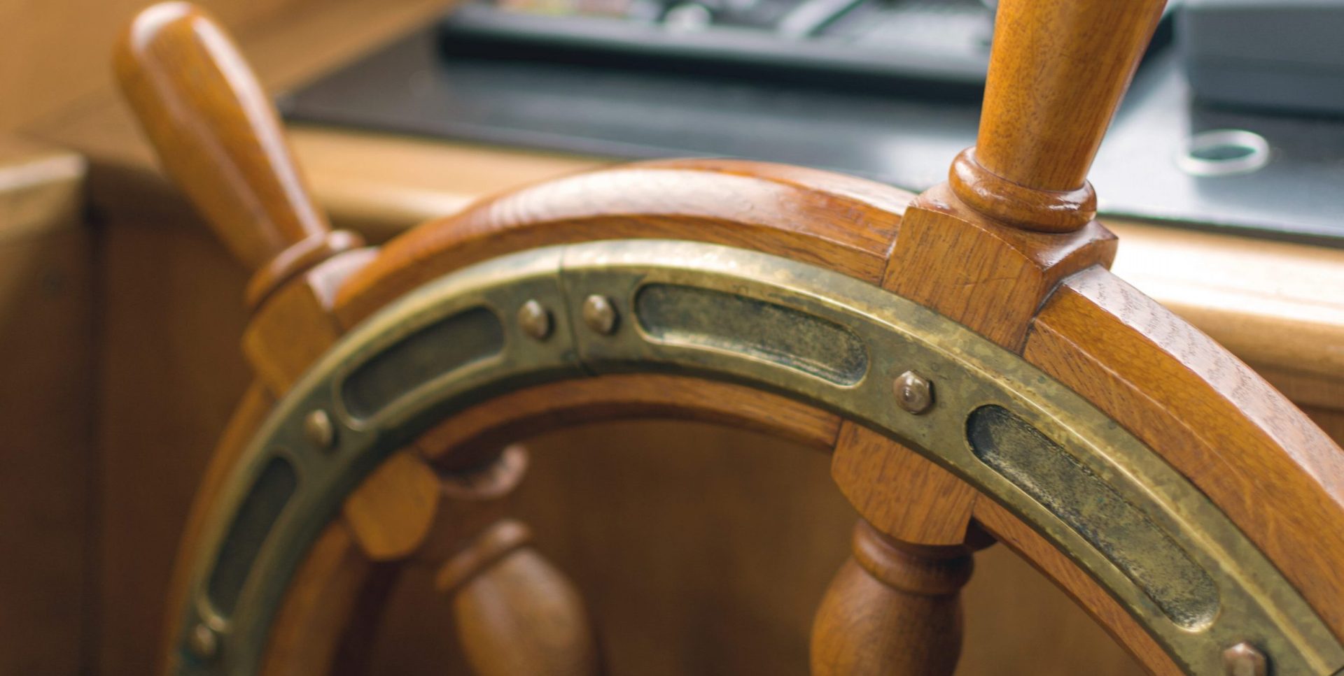 Wooden rudder. Captains steering wheel of an old wooden sailing ship.